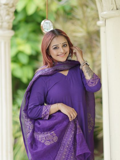 Another angle of the smiling portrait, showcasing the elegant architectural details.