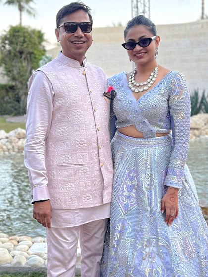 Another look at this stylish father-daughter duo. His pastel pink bandi with intricate self-embroidery is a perfect match for the celebratory mood.