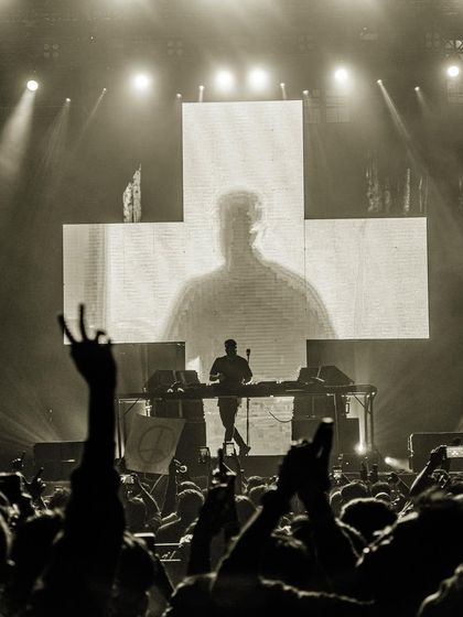 A black and white shot that captures the raw, timeless energy of a live concert.