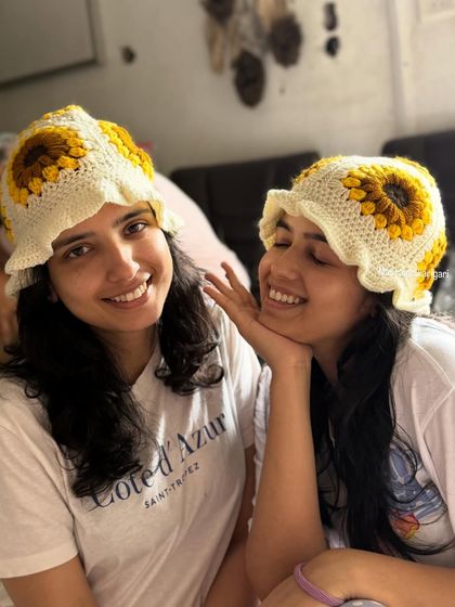 Sharing a happy moment in our matching sunflower crochet hats. It’s moments like these that inspire our work, creating pieces that can be shared and enjoyed together.
