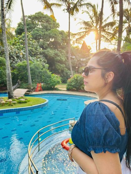 A guest enjoying the sunset view over our pool. These are the beautiful, quiet moments that make a stay at Holiday Village so special.