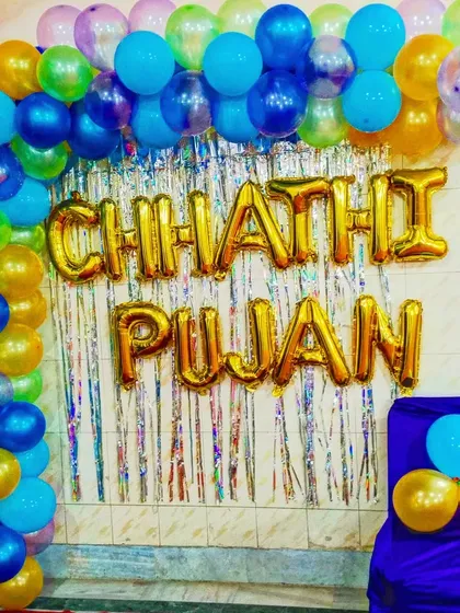 A colorful setup for a Chhathi Pujan ceremony. We used a balloon arch and gold foil letters to create a festive backdrop for the traditional function.