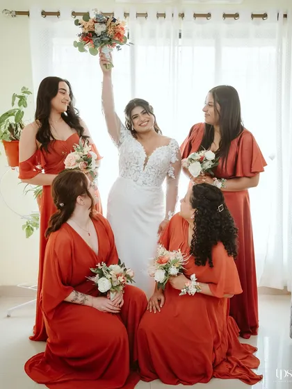 A beautiful shot of the bride with her bridesmaids, all celebrating her special day.