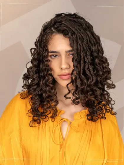 A stunning curly hairstyle created during a masterclass with Bill Watson. This look showcases advanced techniques for cutting and styling curls to create definition, volume, and beautiful shape.
