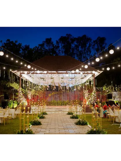 For this sangeet, I transformed an outdoor space into an enchanted wonderland under the stars. A canopy of string lights and suspended disco balls created a magical atmosphere for a night of dancing and celebration.