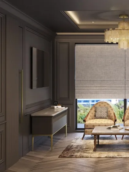 A waiting area within an executive office, designed with a dark, moody palette. The taupe paneled walls, elegant chandelier, and patterned armchairs create a space that feels more like a luxurious lounge than a typical office.