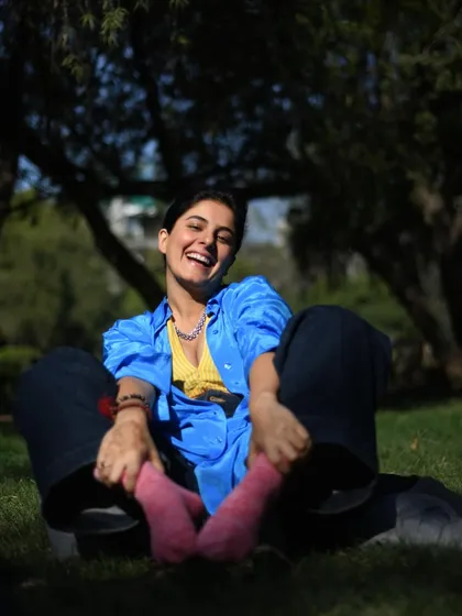 A joyful, sun-drenched photo of Isha Talwar laughing in a park. Capturing pure, uninhibited happiness is one of my favorite things.