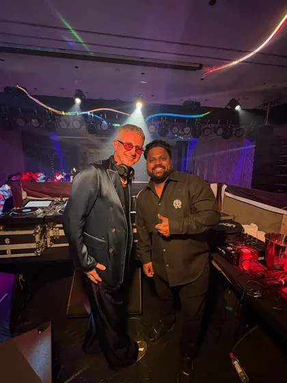 Another shot with a fellow DJ, showing the camaraderie behind the scenes. We're set up with top-tier Pioneer gear, ready to deliver a great show.