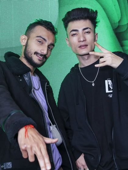 Posing with a fellow artist. I thrive on the creative energy of collaborating with others in the music scene.