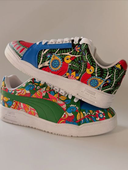 This pair of custom Pumas combines two of my favourite Indian art forms: Kalamkari and Madhubani. The intricate patterns and vibrant birds and flowers create a stunning visual story. This was a special pair made for a fellow artist.
