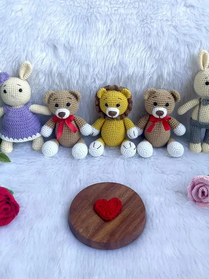 A lovely bunny couple, with the girl in a purple dress and the boy in smart grey trousers and a bow tie. They make a perfect wedding or anniversary gift.