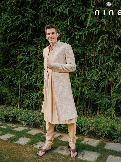 This full-length shot shows how our open sherwani and Choga kurta come together for a complete, festive look. It’s an outfit designed for movement, comfort, and celebration.