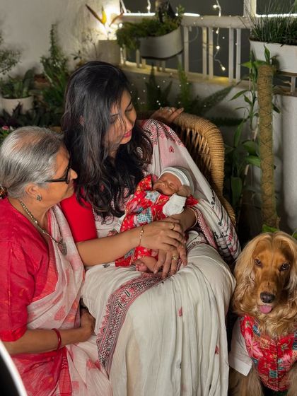 A tender moment between three generations, with Posto looking on, during Diwali.