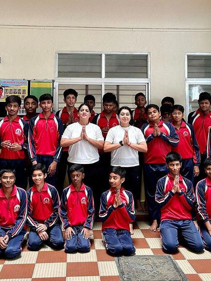 A group photo with young students after a fulfilling yoga session. It’s an honor to introduce them to a practice that builds both physical strength and inner calm.
