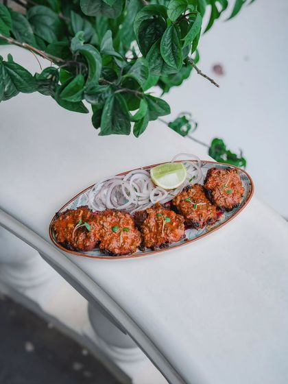 This dish speaks of Portugal’s Assado grills and South America’s chimichurri soul. Chicken thighs are marinated in garlic and chili, then finished with a herbaceous chimichurri.