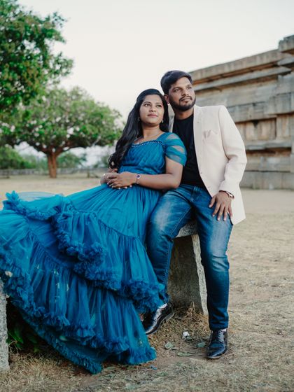 A relaxed pose against a historic backdrop. The couple looks into the distance, dreaming of their future together.