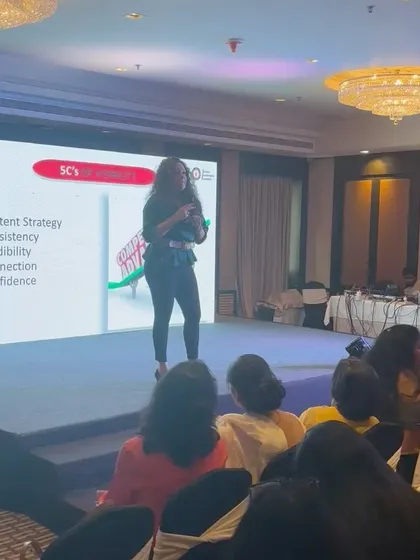 On stage discussing the '5Cs of Visibility' at a Women's Leadership Programme. This framework is a cornerstone of my personal branding workshops.