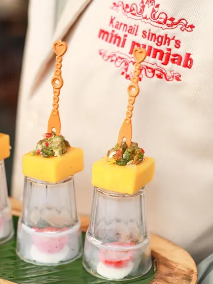 A close-up of our Cheddar Cups, showcasing the vibrant avocado feta topping. We focus on creating bite-sized appetizers that are packed with flavour and visual appeal.
