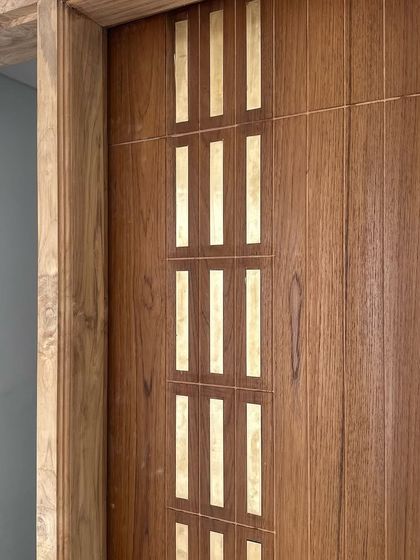 When sketches blossom into beautiful creations on-site, it's truly fulfilling. This teak door with custom brass inlays is an example of how we tailor every detail to make a home feel special and unique.
