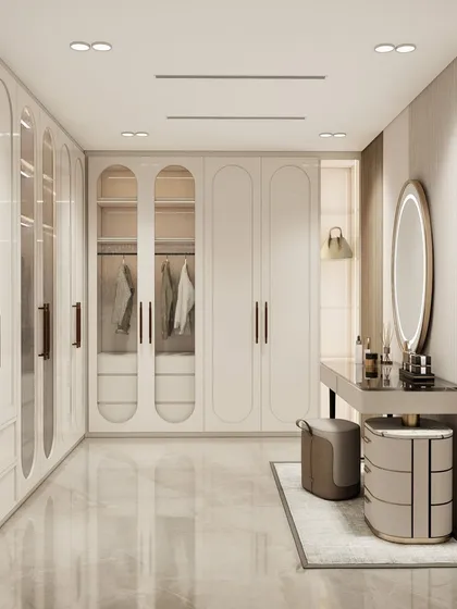 A breathtaking walk-in wardrobe concept with soft architectural curves, pristine white built-ins, and an elegant vanity area.