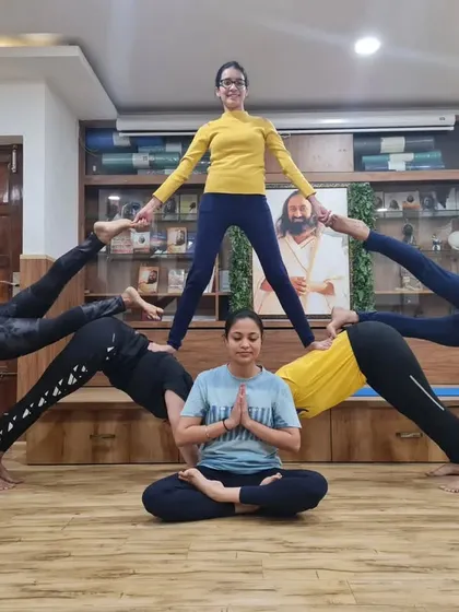 Partner yoga is all about trust, communication, and shared strength. This group pose is a perfect example of how we support each other to create something beautiful and achieve poses we couldn't do alone.