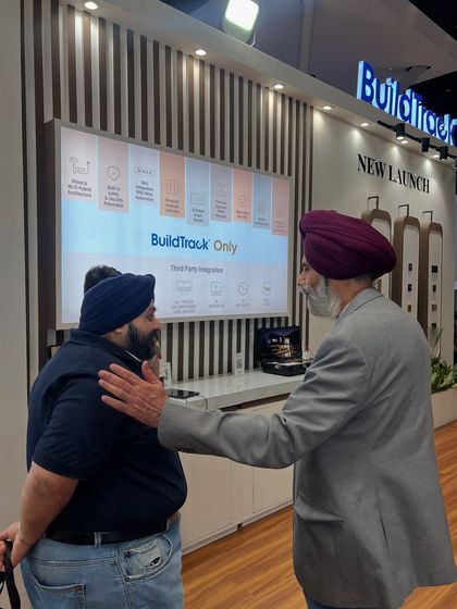 A moment of connection at our Smart Home Expo booth. Our team is dedicated to having meaningful conversations and understanding the unique needs of every visitor.