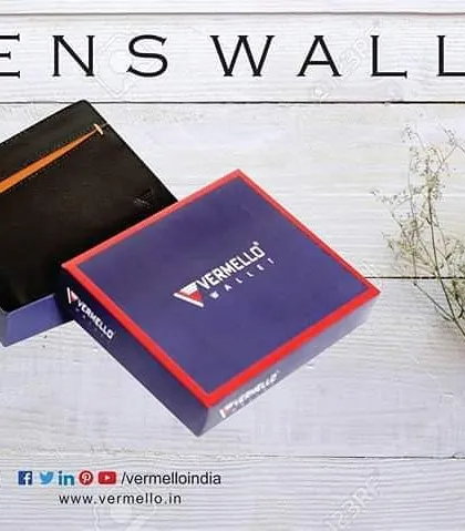 A lifestyle presentation of our men's wallet in its signature Vermello gift box. The packaging is designed to be sturdy and professional, reflecting the quality of the leather goods inside.