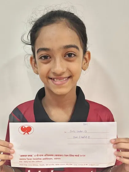 Saisha Madhur holds her prize after winning a bronze medal in the Under-13 girls' category at the Maharashtra State Ranking Tournament in Jalgaon.