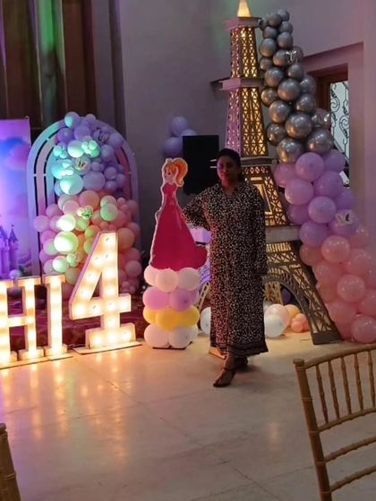 Our team member posing with a princess character cut-out, ready for the party to begin.