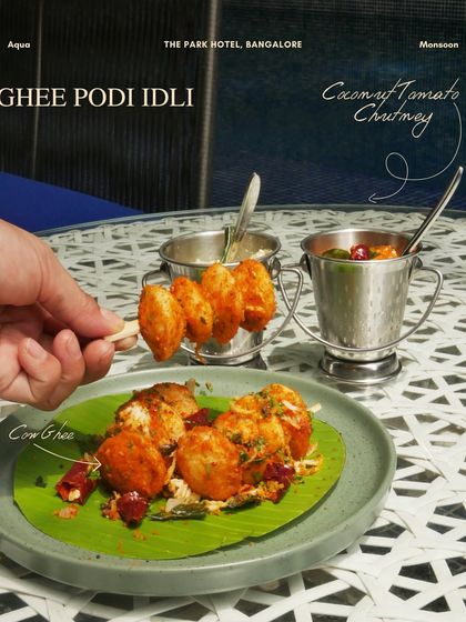 Our new Ghee Podi Idli, served on a banana leaf with coconut and tomato chutney. A modern twist on a South Indian classic.