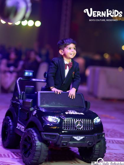 A smile that says it all. Dressed in his bespoke tuxedo, this birthday boy is ready for his party. We ensure our formal wear is comfortable enough for even the most energetic little clients.
