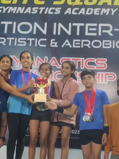 Our team champions with their trophy. This victory is a result of their collective hard work, synchronization, and team spirit.
