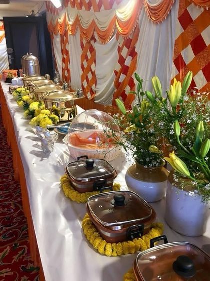 For a Kanha Kirtan, I used a beautiful hand-painted Pichwai lotus motif from Nathdwara. The buffet table was adorned with fresh flowers and served traditional Prasad and Bhog.