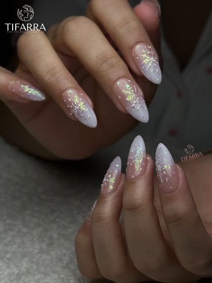 A different angle of the stardust snowflake nails, showing the delicate glitter and 3D details.