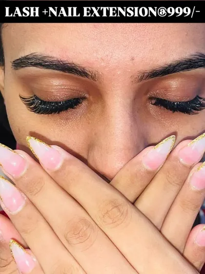 A great example of my nail and lash combo deals. This client got a beautiful set of stiletto nail extensions with glittery gold French tips and a full set of eyelash extensions.