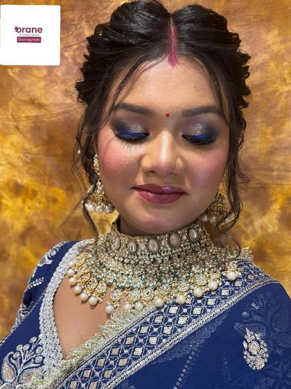 An unfiltered shot of a student's work, showcasing a bold blue smokey eye. I encourage students to practice and perfect challenging looks like this.