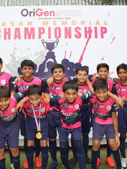 Our Under 11 team posing with their coaches at the event.