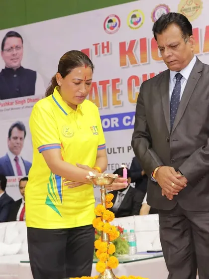 The Hon’ble Minister lighting the ceremonial lamp at the KIO National Championship. Such traditions are an integral part of our event openings.