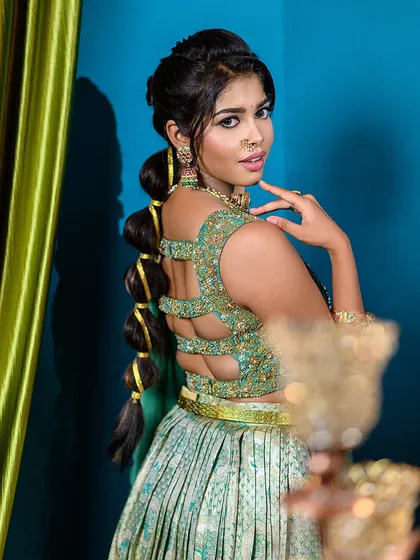 This shot highlights the creative bubble ponytail hairstyle, a key part of the semi-traditional look. It shows our attention to capturing every detail of the styling.
