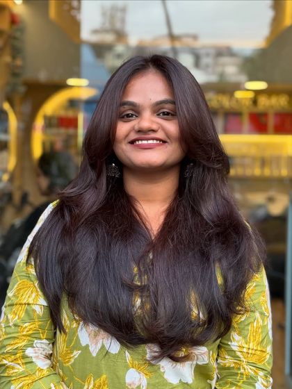 The smile says it all. A great layered haircut not only looks good but also makes you feel fantastic and confident.