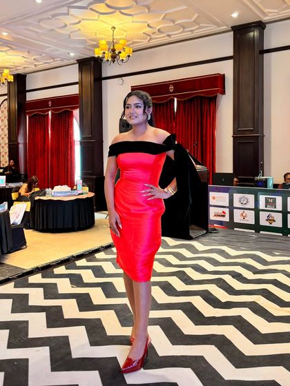A full-length view of my outfit and the event space. I always dress to match the theme and energy of the party.
