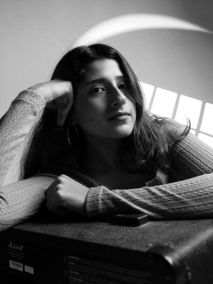 A black and white portrait with a Marshall amp.