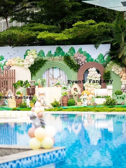 Advaith's woodland theme set up by a beautiful pool. This image shows how I can adapt my magical setups to unique venues, creating a stunning visual contrast between the rustic woods and the sparkling water.