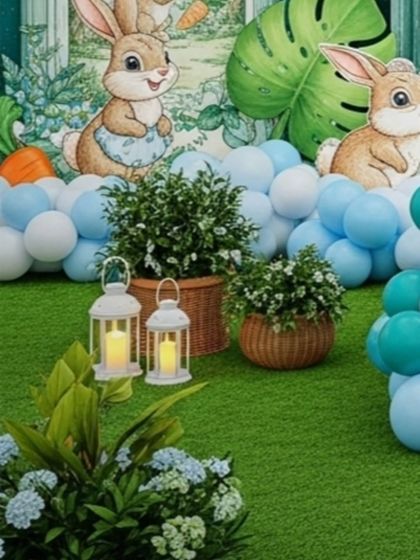 A close-up of the ground-level decor, featuring wicker baskets with greenery and glowing lanterns. These elements add texture and warmth to the base of the main stage setup.