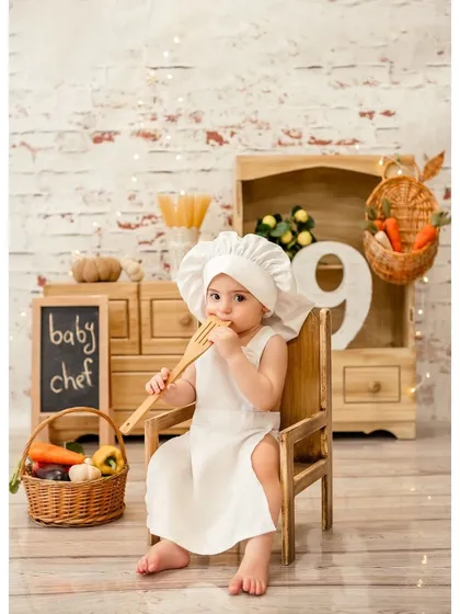 A portrait of our little chef at nine months old. The props and setup create a complete story, making for a unique and memorable milestone photo.