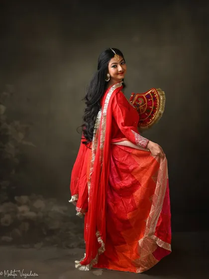 A traditional Punjabi look for an actor's portfolio. The vibrant red Phulkari outfit and classic accessories create a culturally rich and expressive character, perfect for period roles or traditional stories.