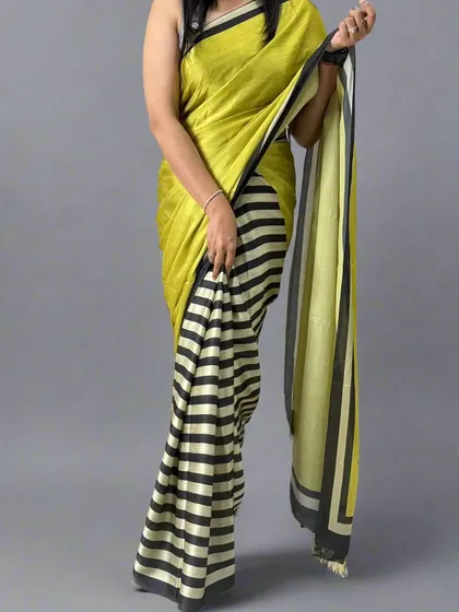 Another angle of the contemporary black, white, and yellow saree, showing its unique drape.