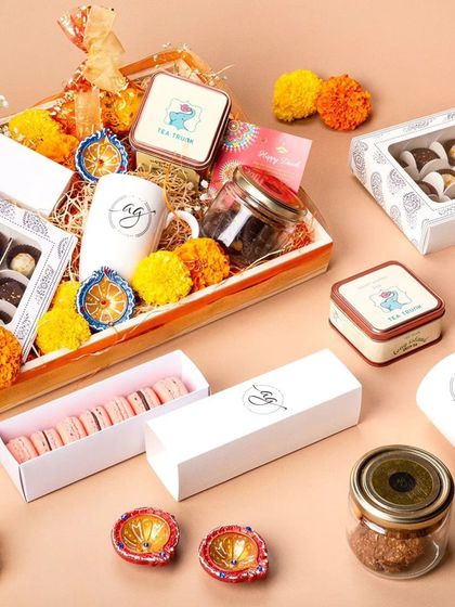 Another look at my gourmet Diwali hamper, showcasing the variety of treats inside. It includes macarons, chocolate bonbons, cookies, and tea, all elegantly arranged for a memorable gift.