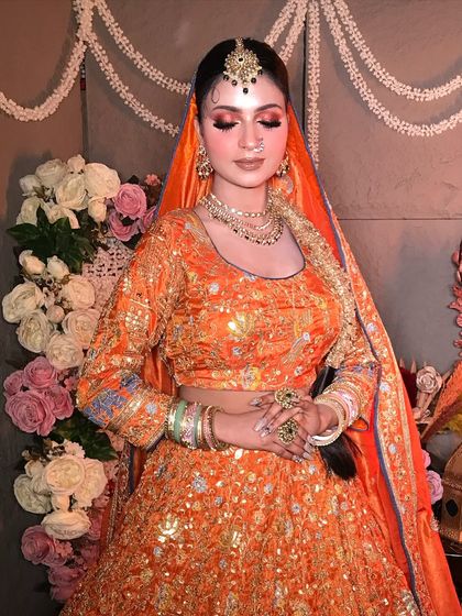 A serene and graceful pose with eyes closed, showing the beautiful blend of the eyeshadow and the overall harmony of the look.