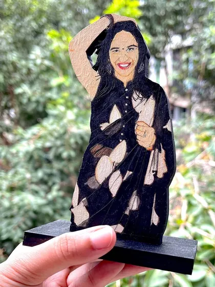 I really enjoyed painting the details on this saree for a custom wooden miniature. It's these personal touches that make each cutout a one-of-a-kind gift.